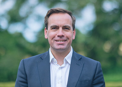 Portrait photo of executive director Matt Greenfield
